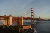 The golden gate bridge towering over the ocean